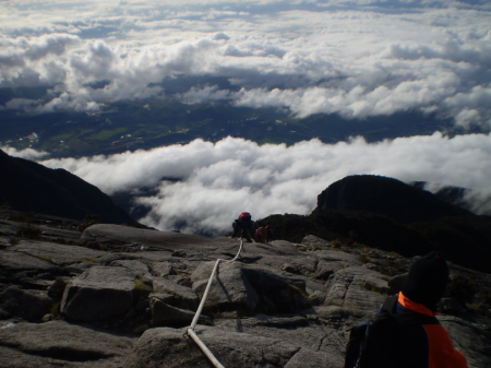 Clouds start to surround the peak of Mt. Kinabalu as early as 7.00 am. By 9.00 am, all hikers should have descended to Laban Rata. Nobody is allowed to stay at the summit as winds start to blow ferociously which sweep the area with a terrible force